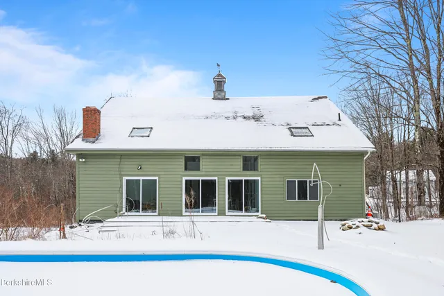 a view of a yard covered in snow