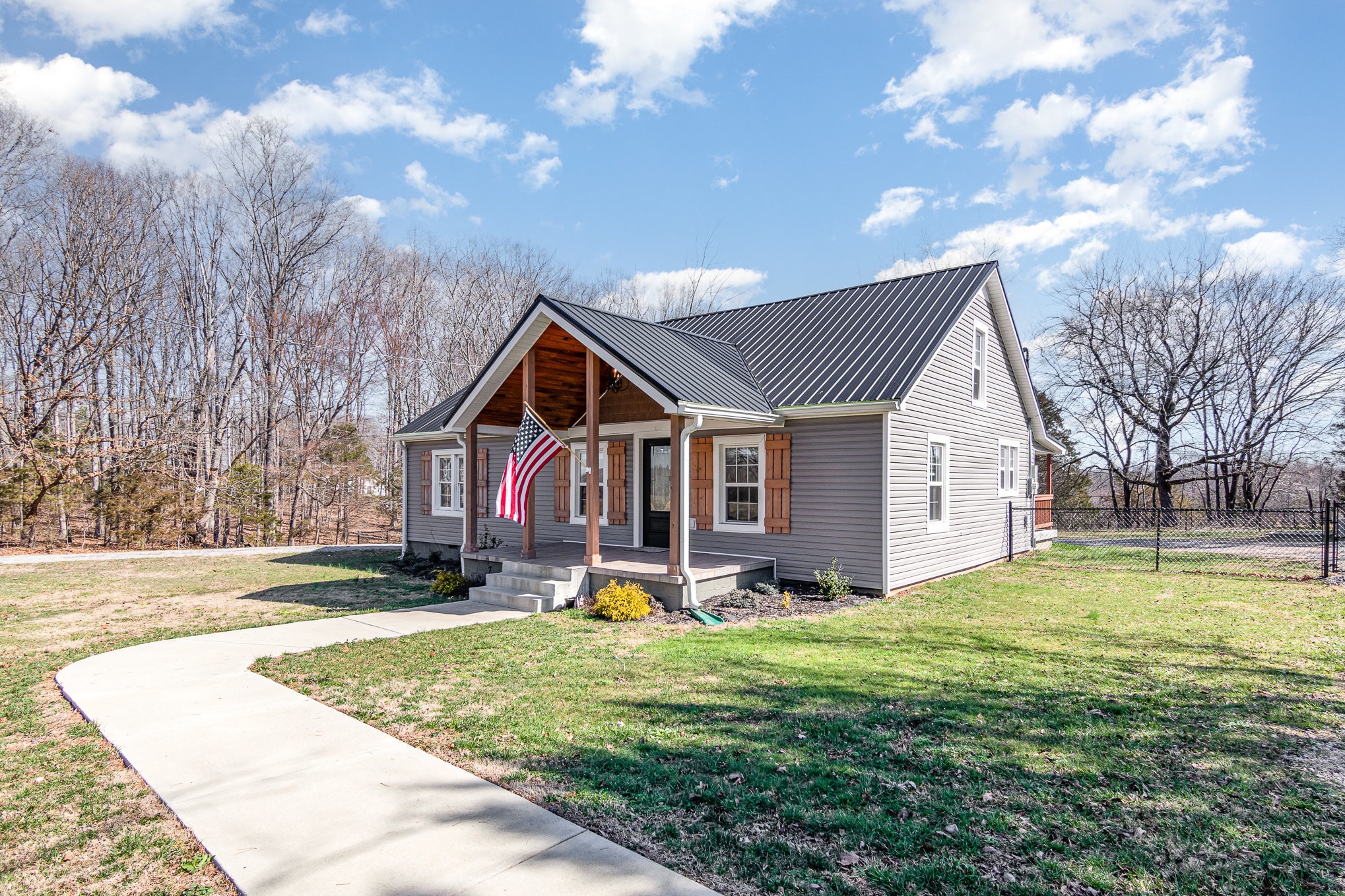 4901 Marion Road Cunningham, TN 37052 - Photo 1 of 35 a front view of house with yard and trees in the background