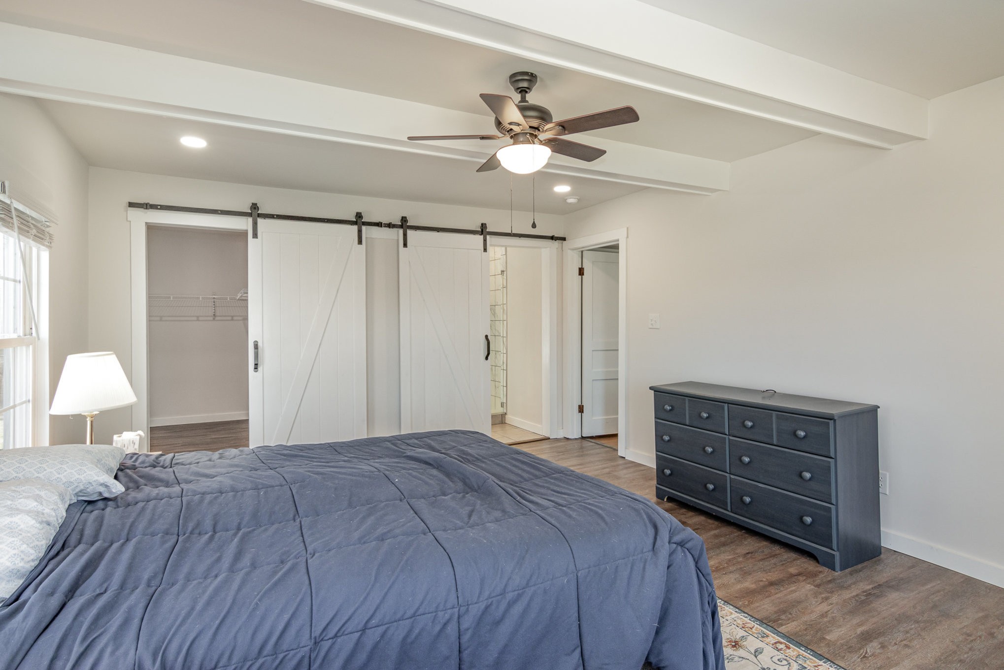 4901 Marion Road Cunningham, TN 37052 - Photo 17 of 35 a bedroom with a bed and a chandelier