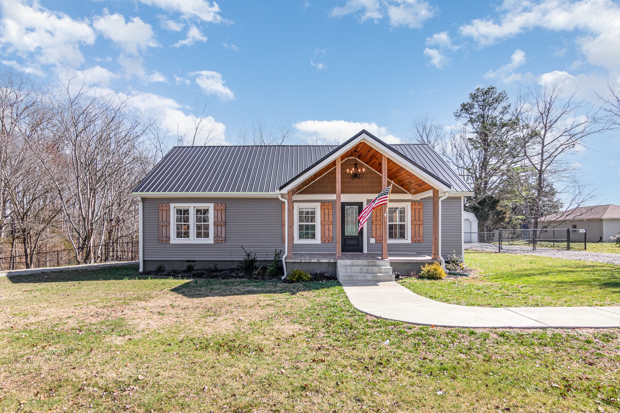 4901 Marion Road Cunningham, TN 37052 - Photo 2 of 35 a front view of a house with a yard