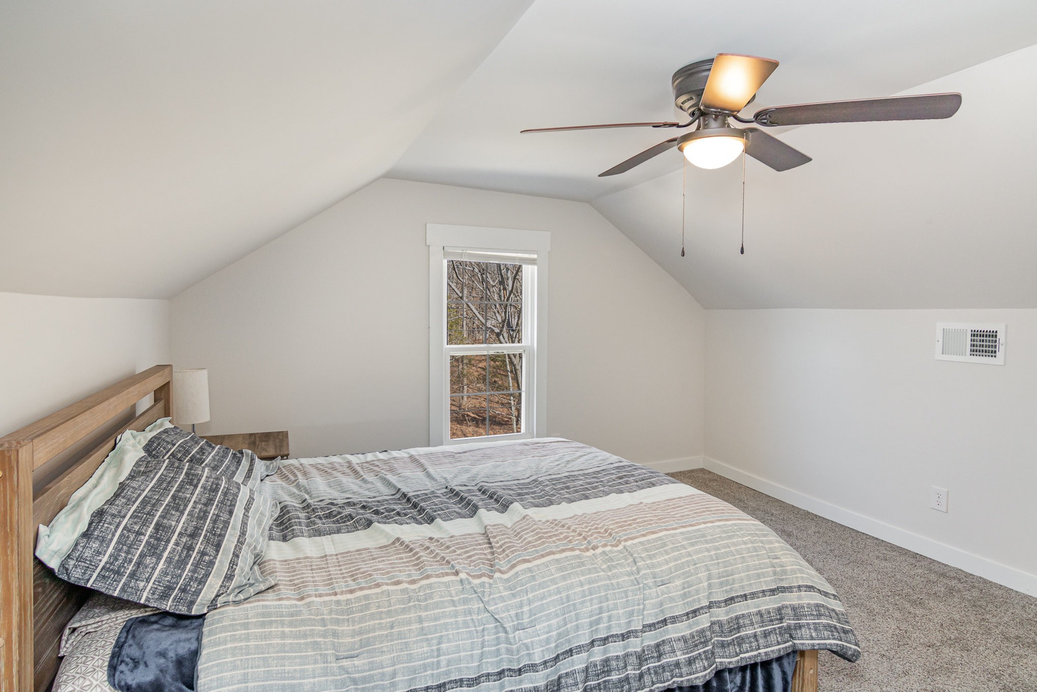 4901 Marion Road Cunningham, TN 37052 - Photo 21 of 35 a bedroom with a bed and a chandelier
