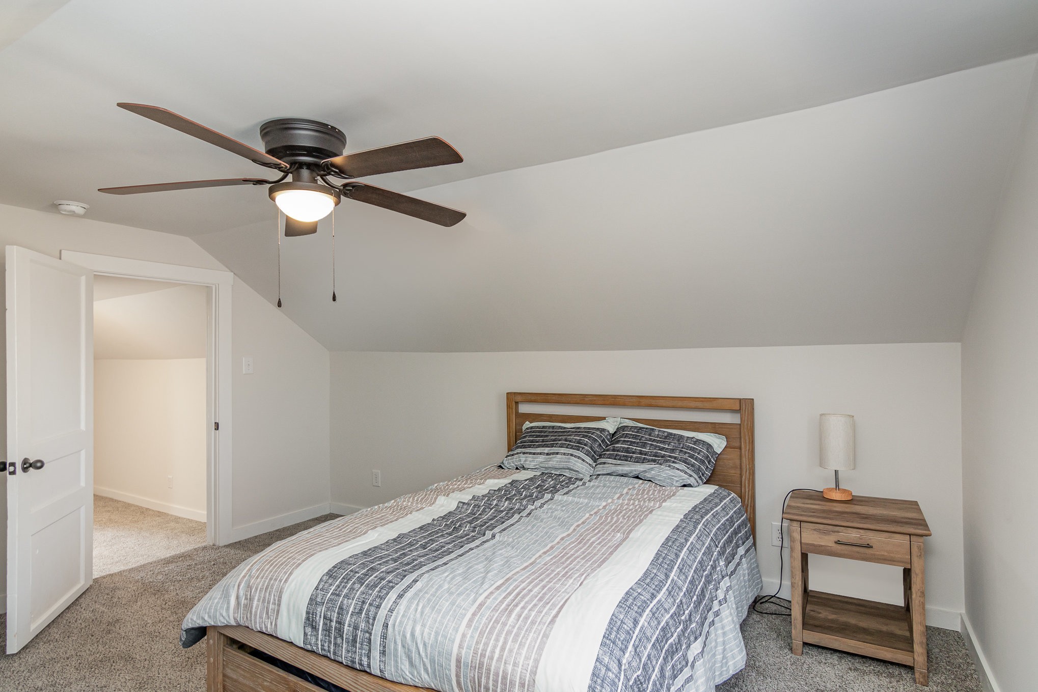 4901 Marion Road Cunningham, TN 37052 - Photo 23 of 35 a bedroom with a bed and a chandelier