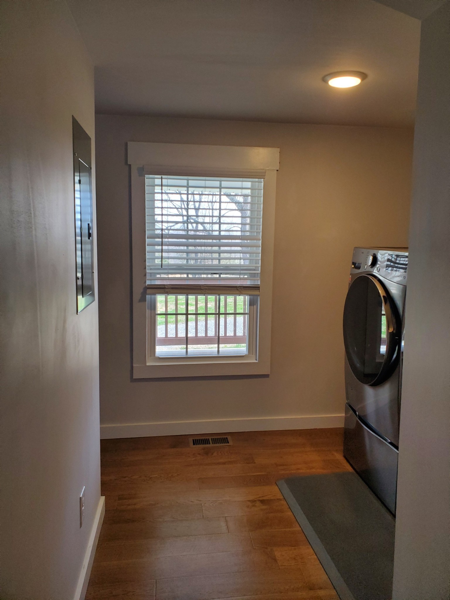 4901 Marion Road Cunningham, TN 37052 - Photo 33 of 35 an empty room with wooden floor and windows