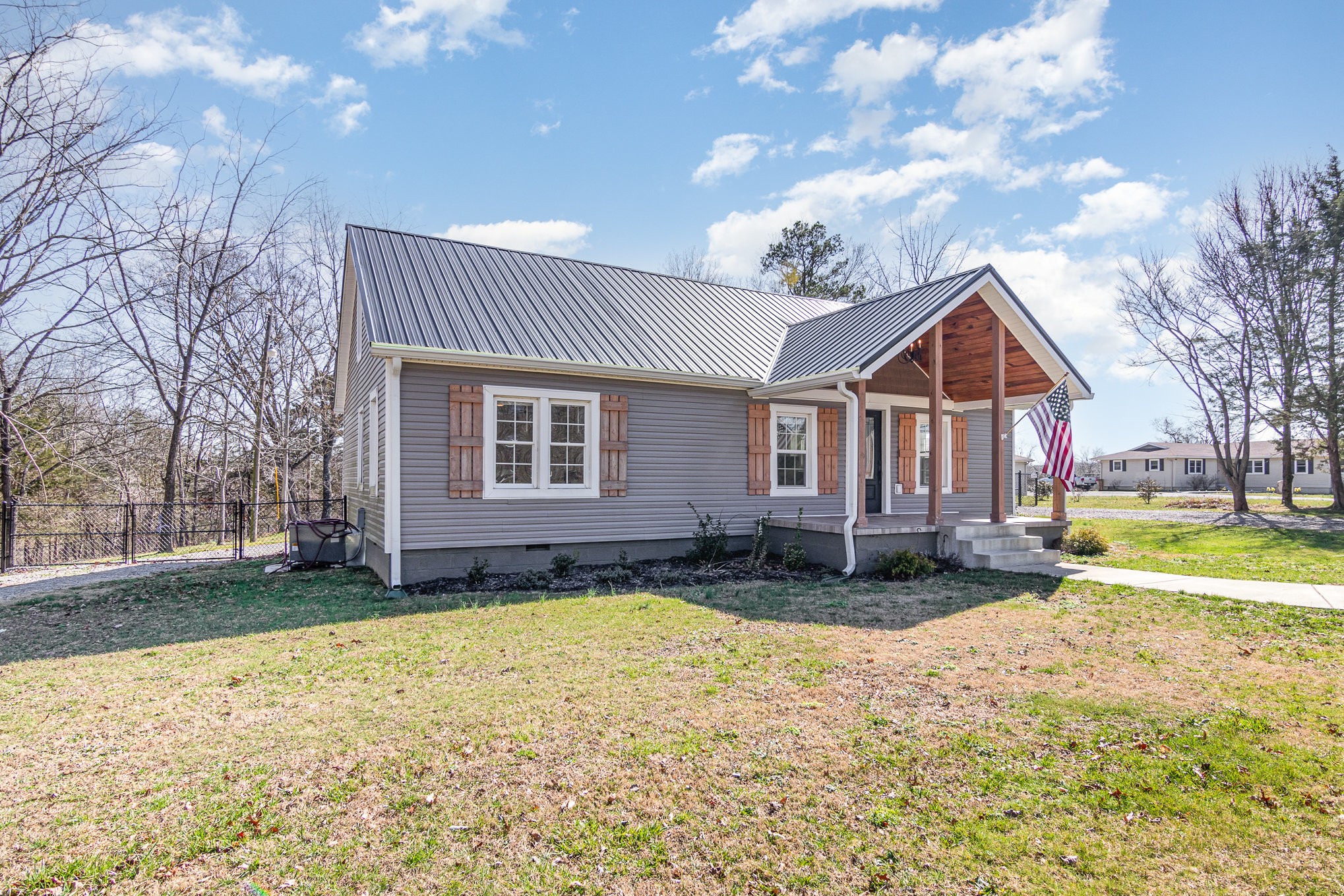 4901 Marion Road Cunningham, TN 37052 - Photo 4 of 35 a front view of a house with a yard