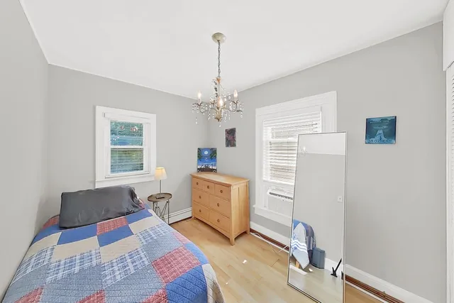 a utility room with toys and a chandelier