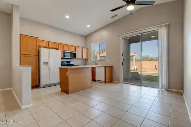 a kitchen with stainless steel appliances a stove cabinets and a kitchen view