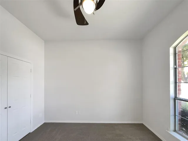 a view of a room that has a window in it