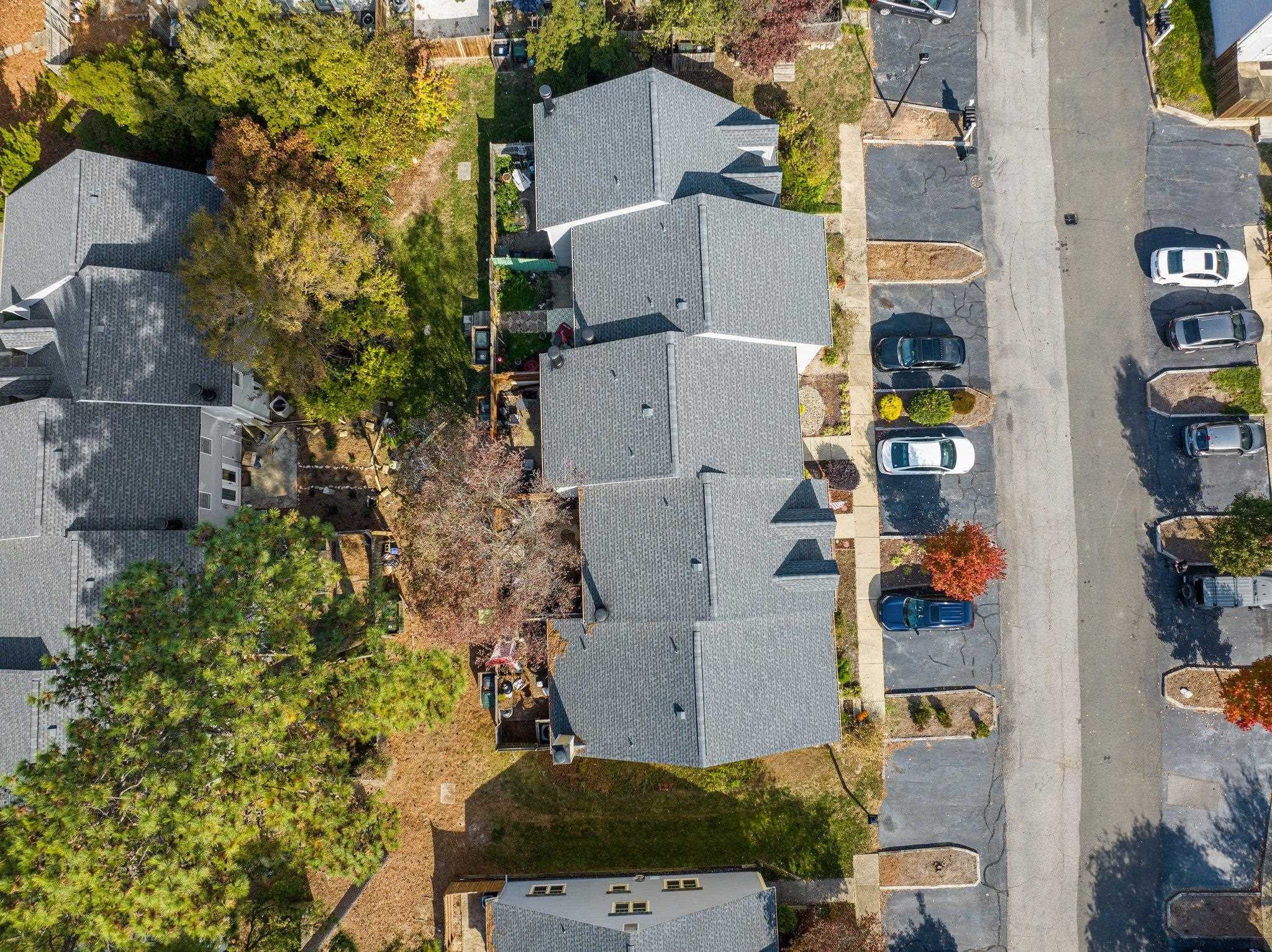 5619 Split Oak Way Raleigh, NC 27609 - Photo 33 of 36 an aerial view of residential houses with outdoor space and parking
