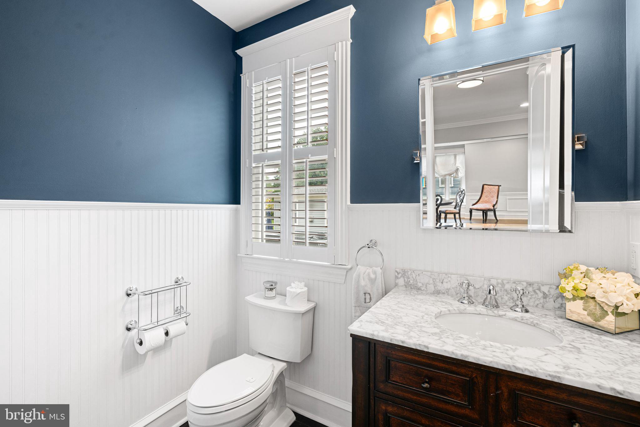 415 Washington Avenue Haddonfield, NJ 08033 - Photo 18 of 51 a bathroom with a granite countertop sink and a toilet