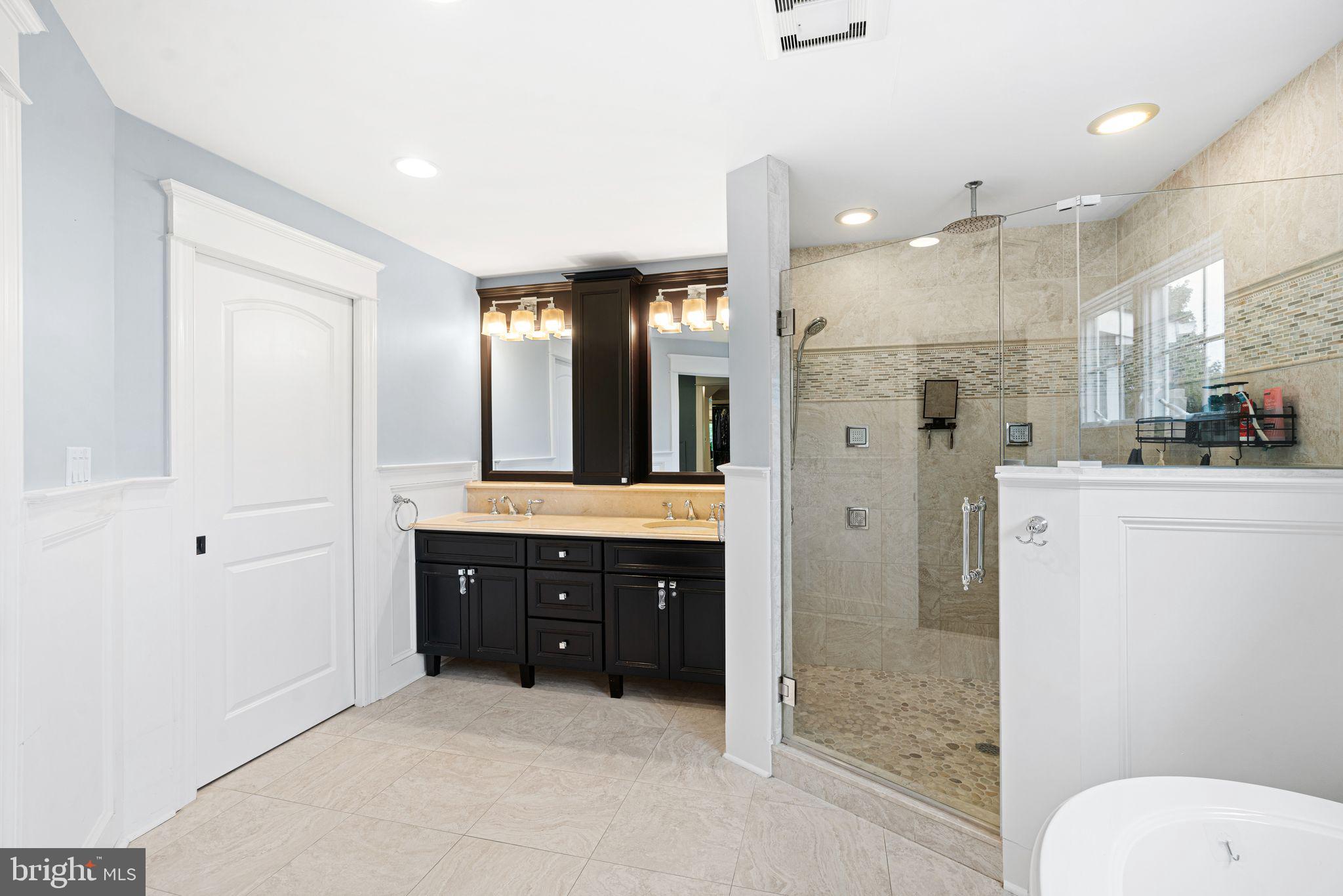 415 Washington Avenue Haddonfield, NJ 08033 - Photo 23 of 51 a bathroom with a sink a toilet a mirror and shower