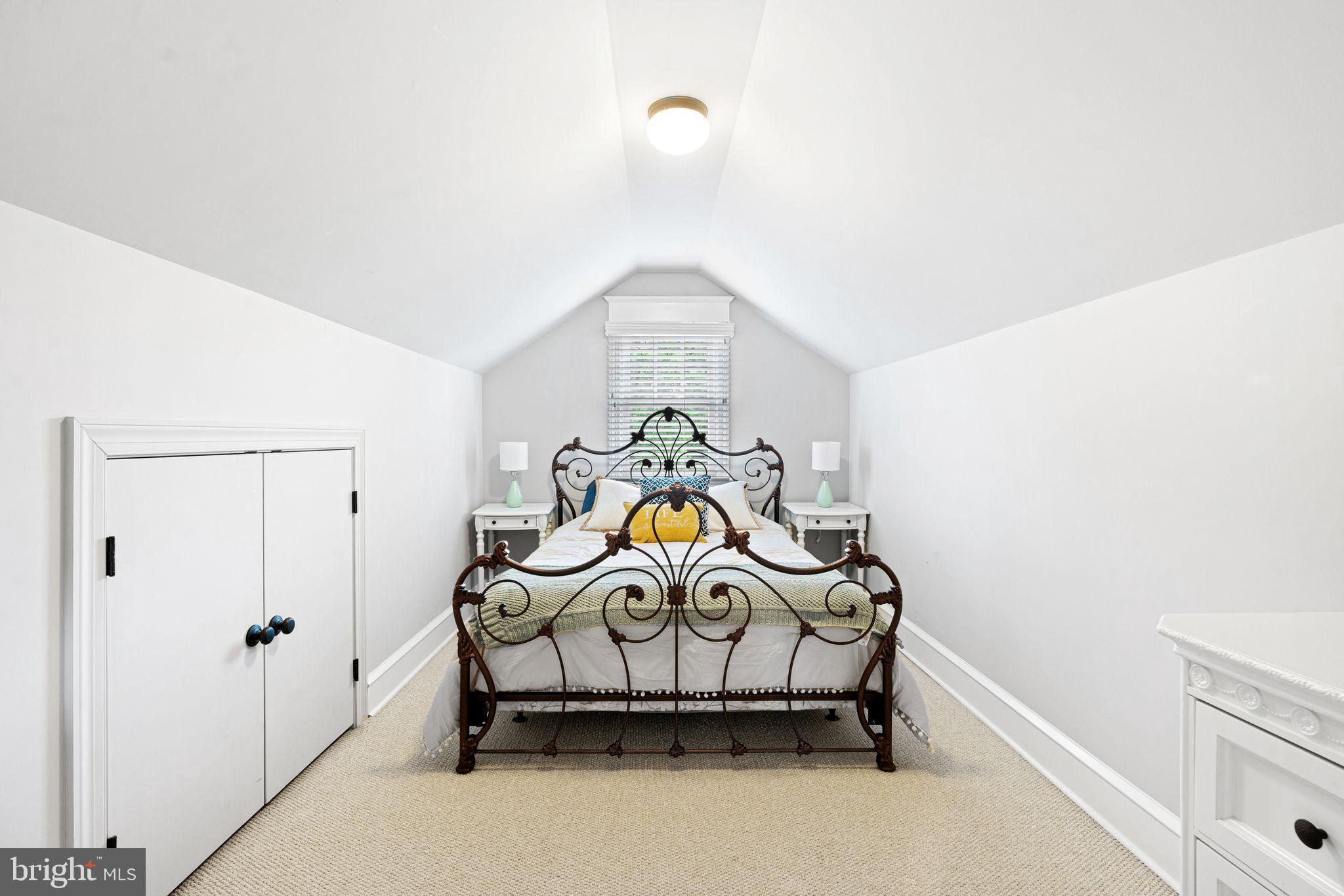 415 Washington Avenue Haddonfield, NJ 08033 - Photo 40 of 51 a bedroom with a bed and a chandelier