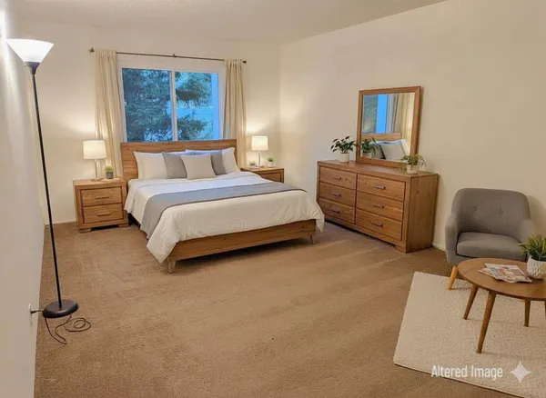 a bathroom with a granite countertop bathtub shower and toilet