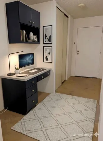 a bedroom with a bed and a cabinets