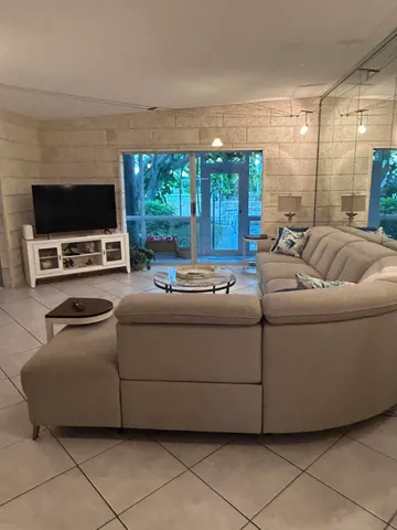 a kitchen with stainless steel appliances kitchen island granite countertop a sink and a stove