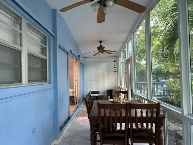 a view of a chairs and table on the deck