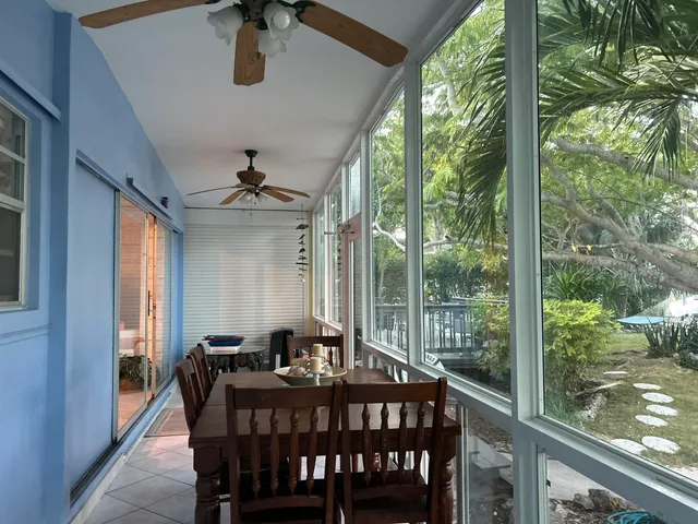 a balcony with trees in front of it
