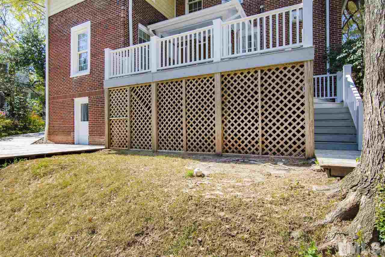 2214 Fairview Road Raleigh, NC 27608 - Photo 22 of 25 a backyard of a house with wooden fence