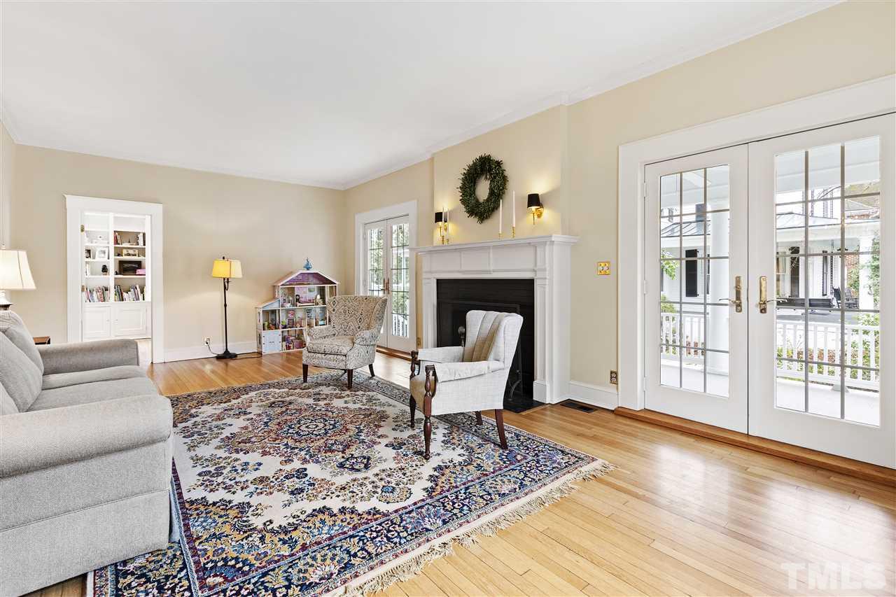 2214 Fairview Road Raleigh, NC 27608 - Photo 4 of 25 a living room with furniture and a fireplace