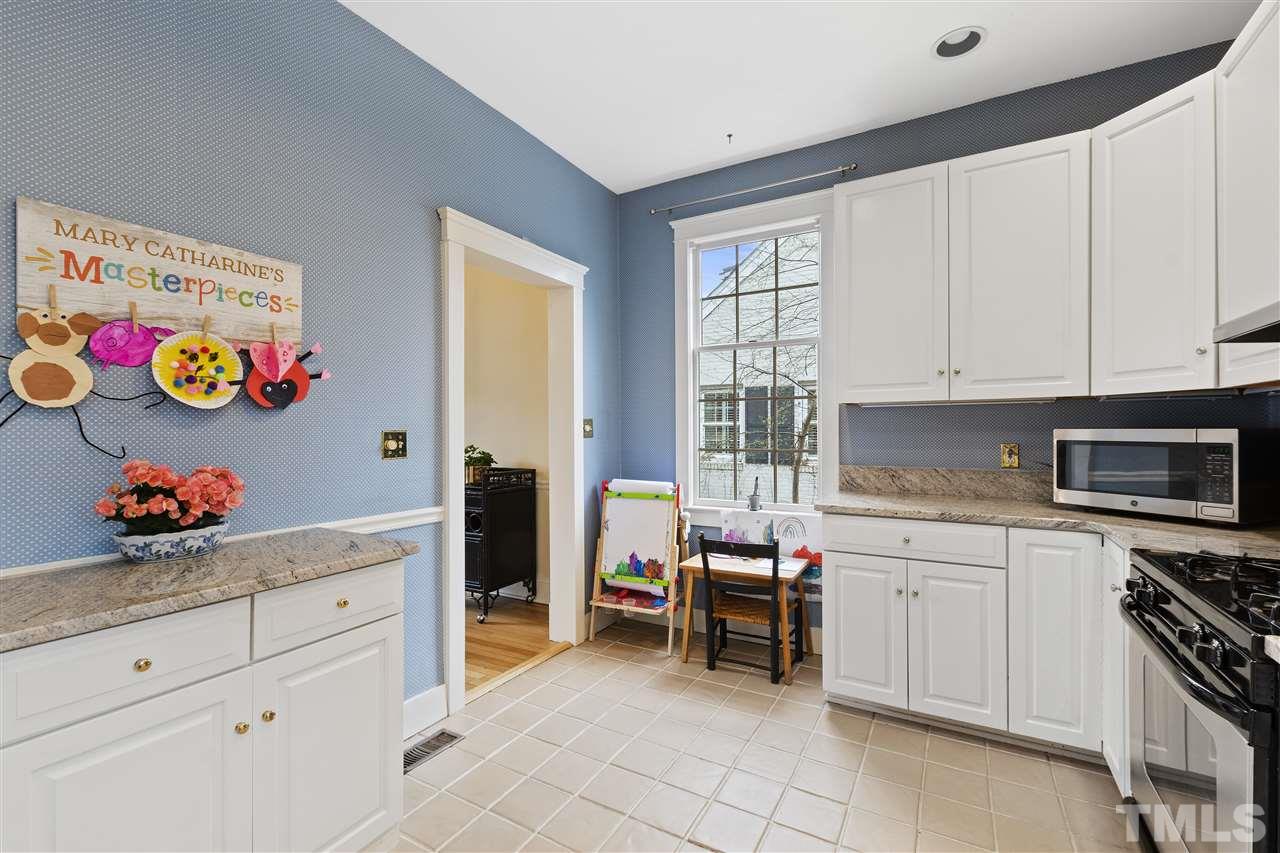 2214 Fairview Road Raleigh, NC 27608 - Photo 9 of 25 a kitchen with a cabinets and window