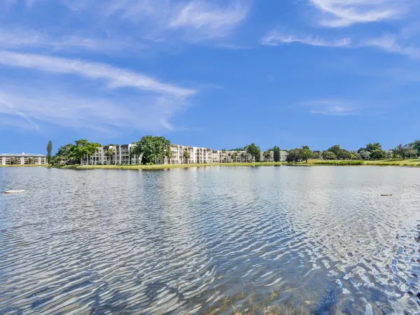 a view of a lake with houses in the background