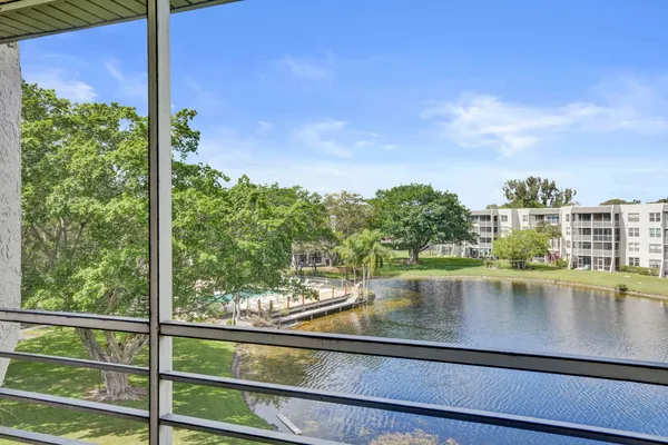 a view of swimming pool from a balcony