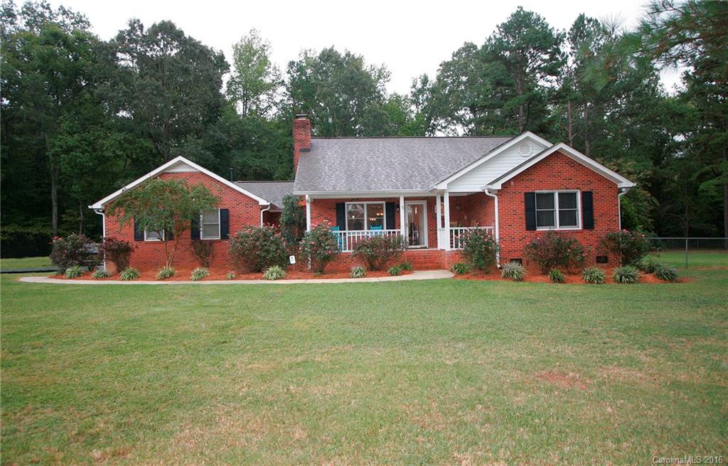 9505 Mini Ranch Road Waxhaw, NC 28173 - Photo 1 of 24 a front view of a house with a yard and green space