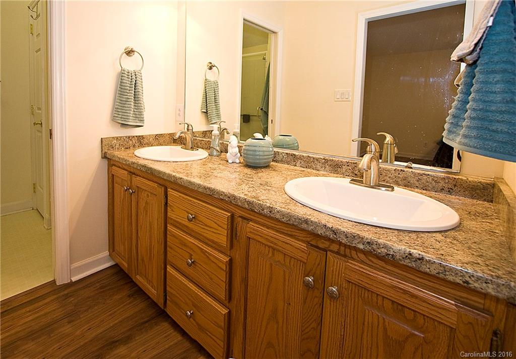 9505 Mini Ranch Road Waxhaw, NC 28173 - Photo 13 of 24 a bathroom with a granite countertop sink and a mirror