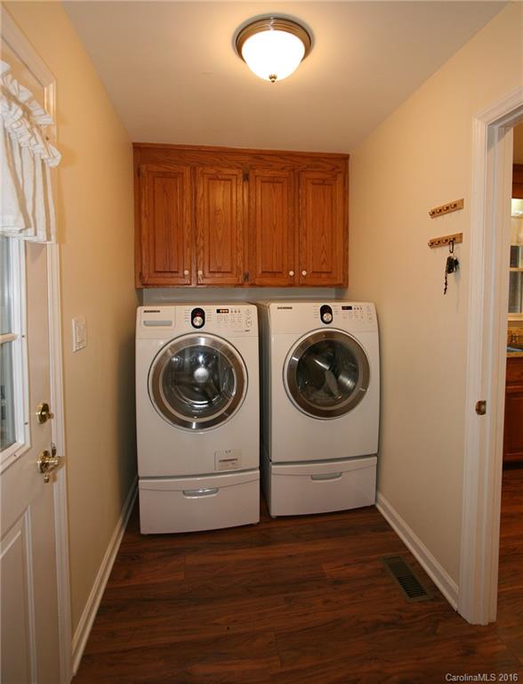 9505 Mini Ranch Road Waxhaw, NC 28173 - Photo 19 of 24 a utility room with wooden floor washer and dryer