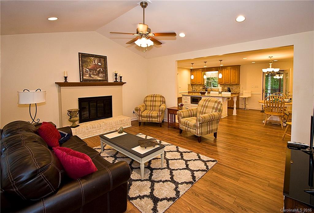 9505 Mini Ranch Road Waxhaw, NC 28173 - Photo 4 of 24 a living room with furniture rug and a fireplace