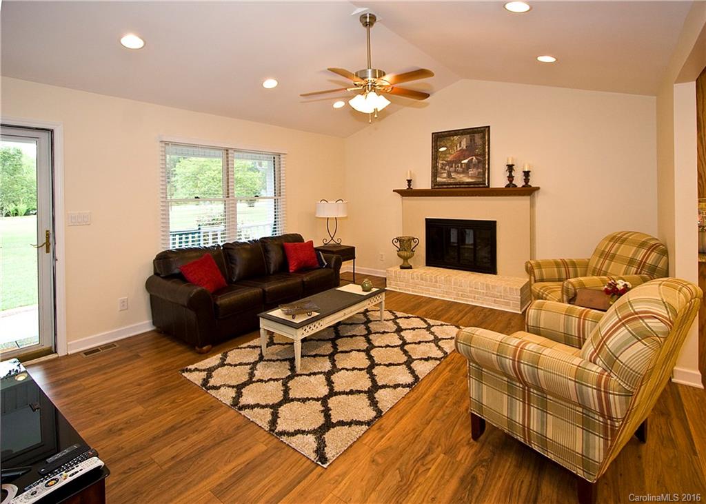 9505 Mini Ranch Road Waxhaw, NC 28173 - Photo 5 of 24 a living room with furniture and a fireplace
