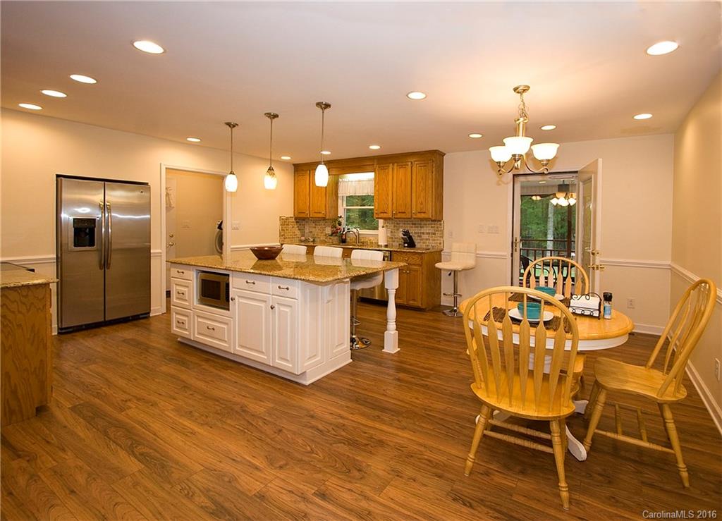 9505 Mini Ranch Road Waxhaw, NC 28173 - Photo 6 of 24 a large kitchen with a table and chairs