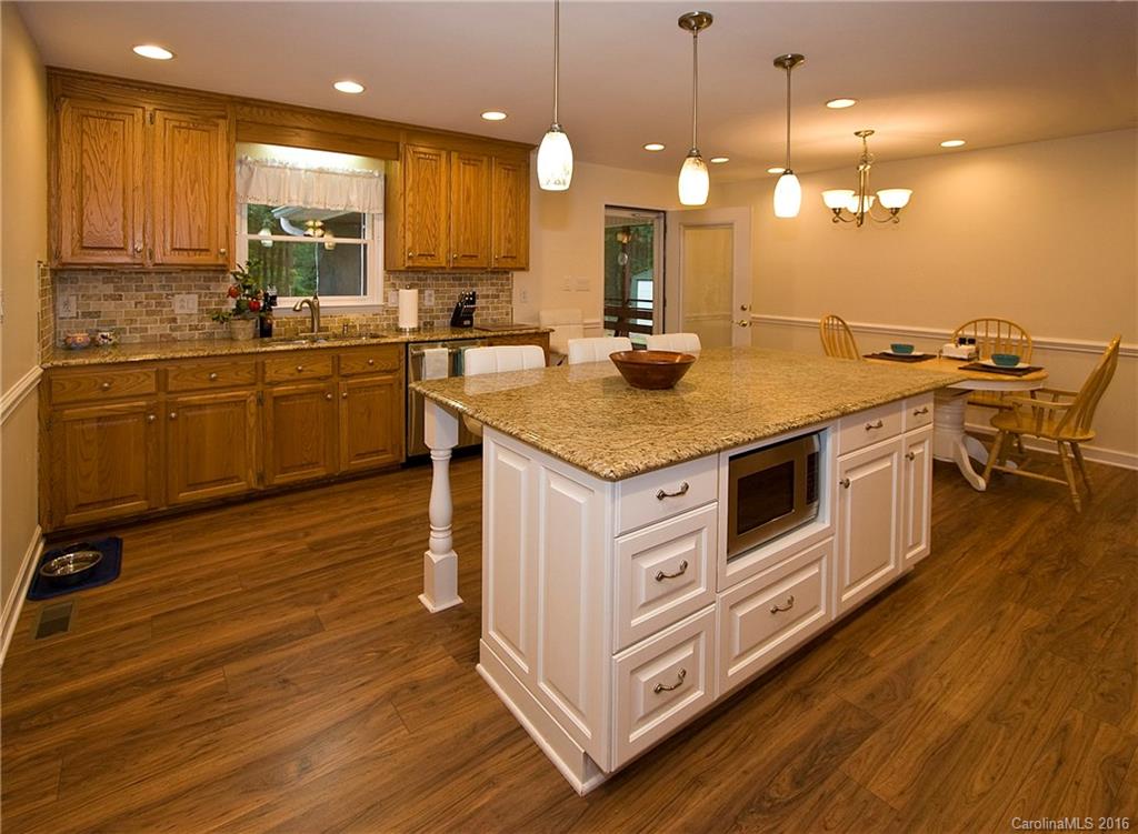 9505 Mini Ranch Road Waxhaw, NC 28173 - Photo 7 of 24 a kitchen with a sink and wooden floor