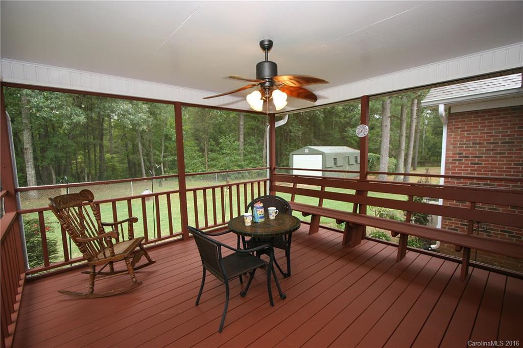 9505 Mini Ranch Road Waxhaw, NC 28173 - Photo 10 of 24 a view of a porch with furniture and wooden floor