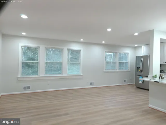 a view of kitchen with wooden floor