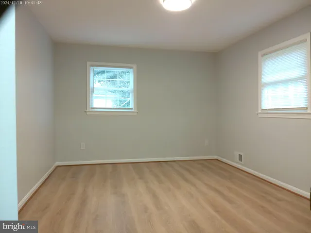 a bathroom with a sink a toilet and vanity
