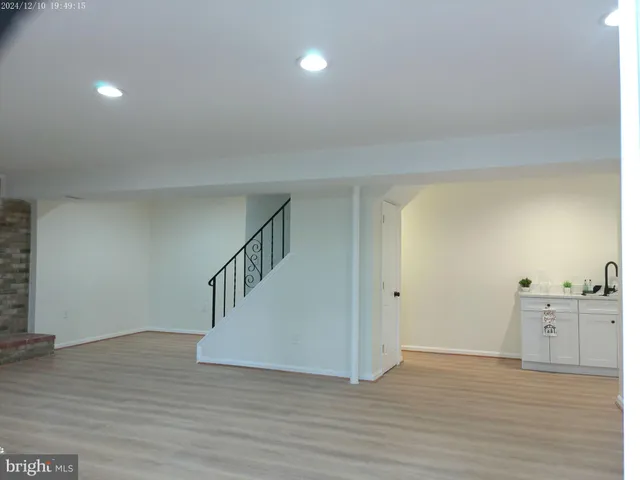 a bathroom with a double vanity sink and mirror