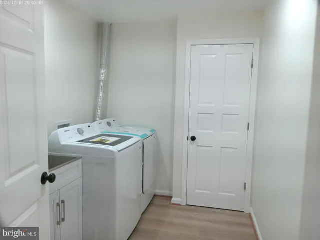 a backyard of a house with a yard and outdoor seating