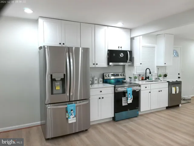 a bathroom with a sink double vanity and a mirror