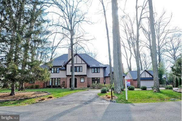 2013 Rockingham Street McLean, VA 22101 - Photo 1 of 30 a front view of a house with a garden and trees