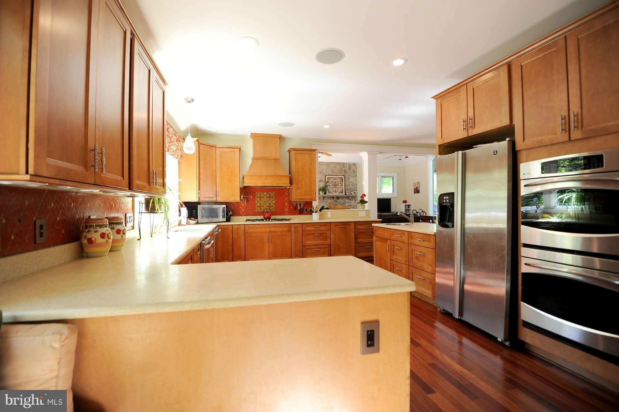 2013 Rockingham Street McLean, VA 22101 - Photo 5 of 30 a large kitchen with stainless steel appliances a refrigerator a sink a stove and cabinets