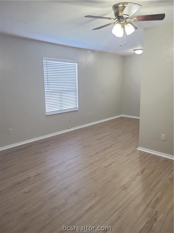 2712 Evergreen Circle Bryan, TX 77801 - Photo 2 of 30 Empty room featuring hardwood / wood-style floors and ceiling fan