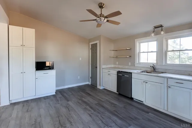 a kitchen with a stove a sink and a refrigerator