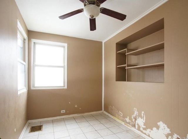 1021 Highmoor Road Lombard, IL 60148 - Photo 14 of 16 a view of an empty room with a window