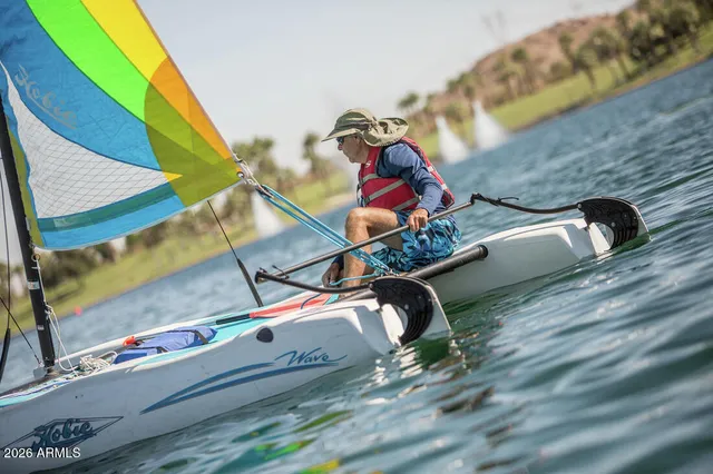 a view of an aerial view of residential houses with outdoor space and trees