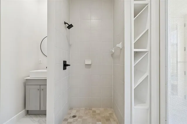 a spacious bathroom with a double vanity sink and a mirror