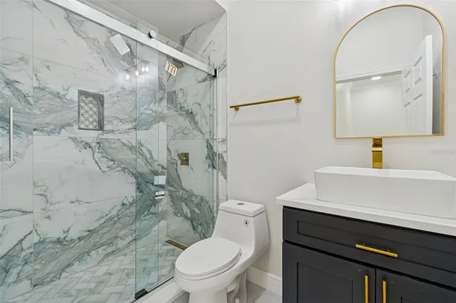 a view of kitchen with sink wooden floor and electronic appliances