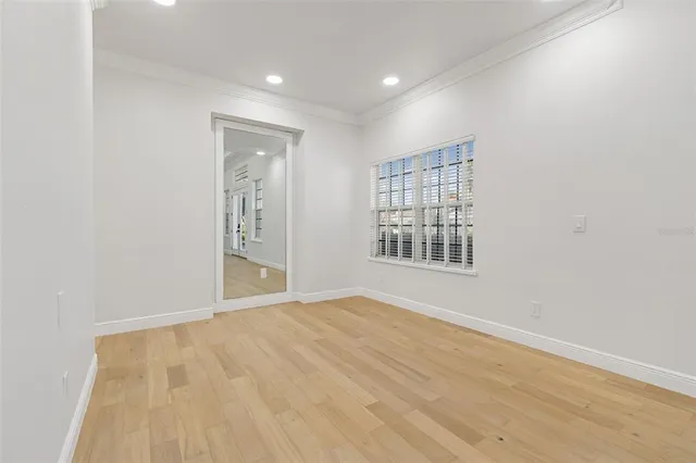 a view of kitchen with sink and refrigerator