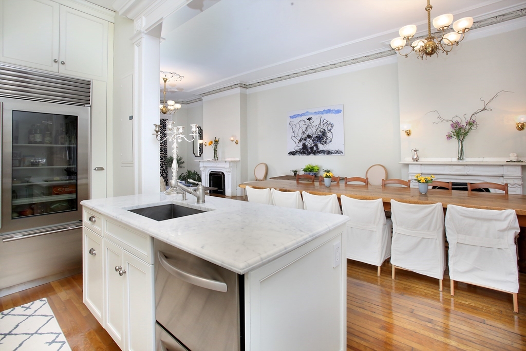 615 Massachusetts Avenue, Unit 2 Boston, MA 02118 - Photo 23 of 32 a view of kitchen island a sink and a refrigerator