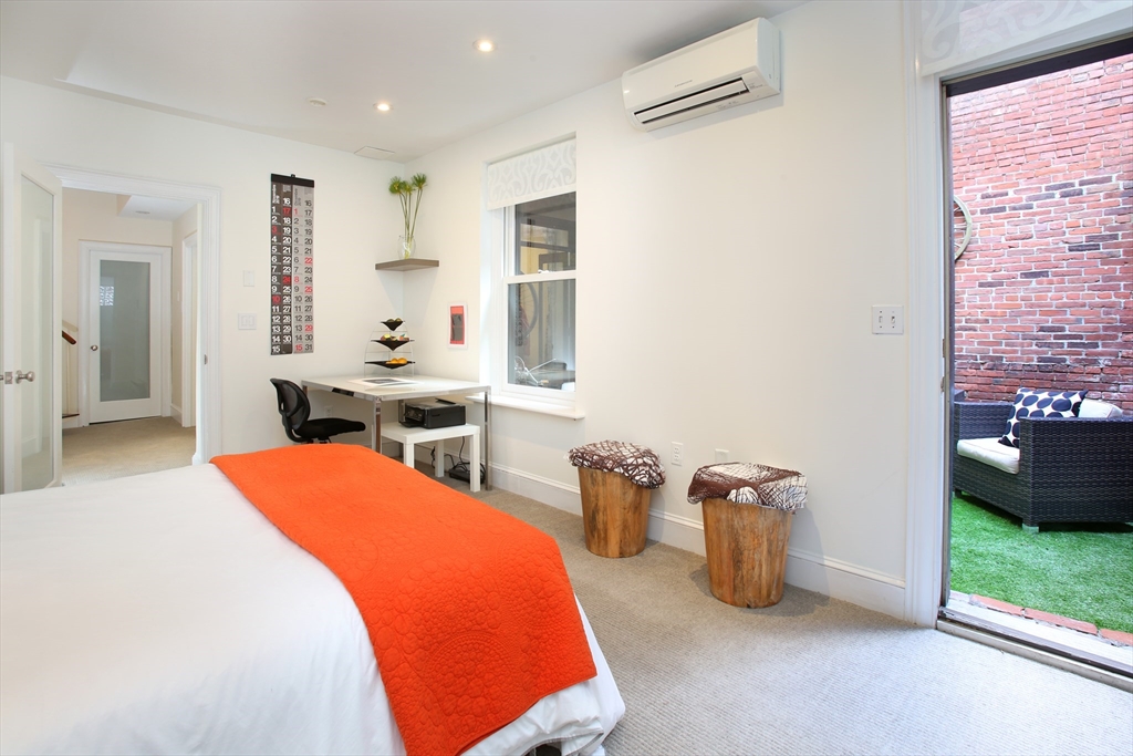 615 Massachusetts Avenue, Unit 2 Boston, MA 02118 - Photo 29 of 32 a room with a bed and a view of kitchen