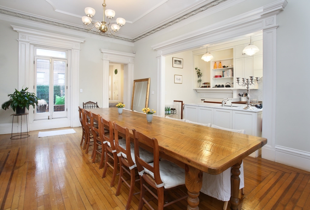 615 Massachusetts Avenue, Unit 2 Boston, MA 02118 - Photo 3 of 32 a view of a dining room with furniture and wooden floor